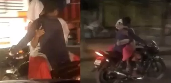 Couple Romance on Bike : चलती बाइक पर कपल कर रहे थे रोमांस, वीडियो हुआ वायरल, पुलिस ने काटा चालान...